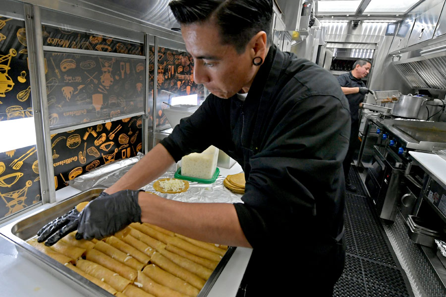 Luis & Leo cooking Enchiladas